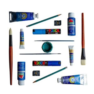 Assorted acrylic paint tubes and brushes on white background