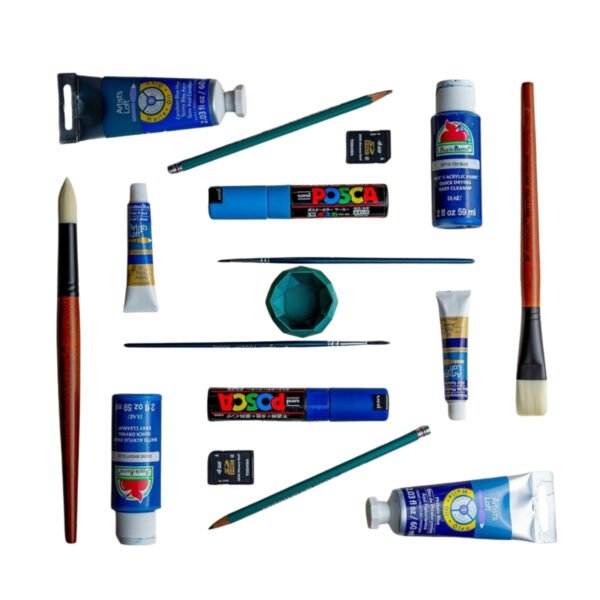 Assorted acrylic paint tubes and brushes on white background
